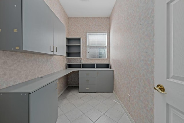 unfurnished office featuring light tile patterned floors