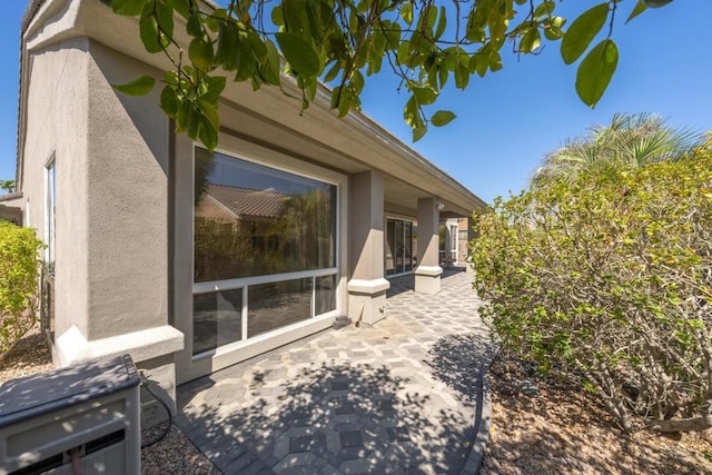 view of side of home featuring a patio