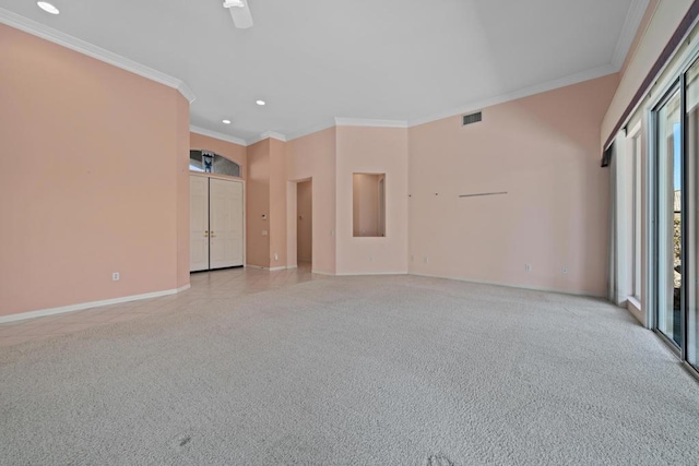 spare room featuring ceiling fan and crown molding