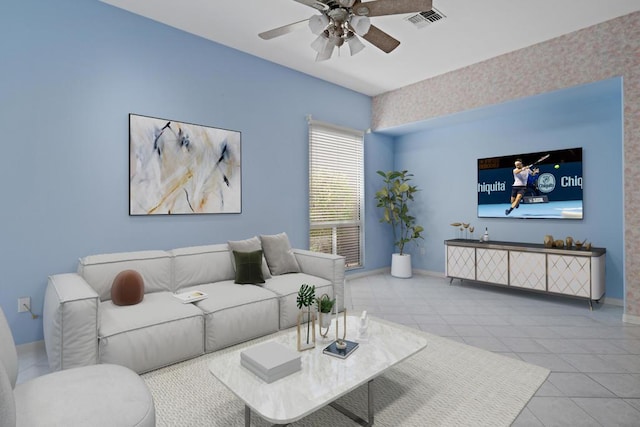 living room featuring ceiling fan and light tile patterned floors