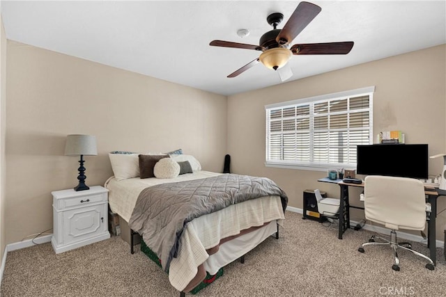 bedroom with ceiling fan and light carpet