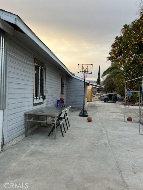 view of patio terrace at dusk