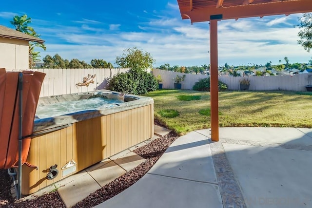 view of yard featuring a patio area and a hot tub