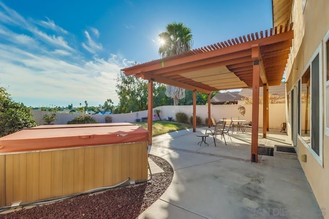 view of patio / terrace with a hot tub