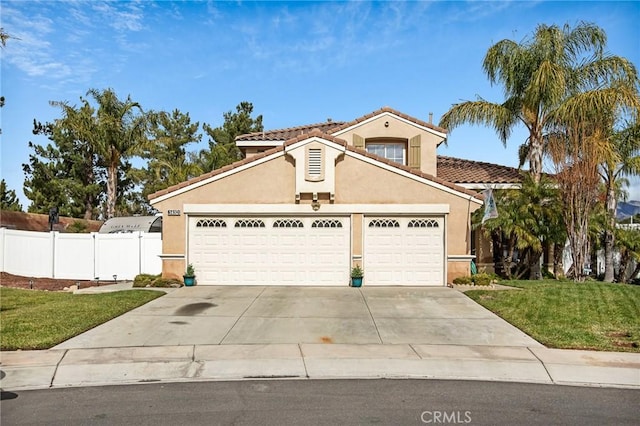 view of front facade featuring a front yard and a garage