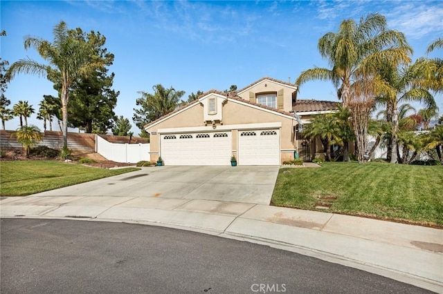 view of front of home featuring a garage and a front lawn