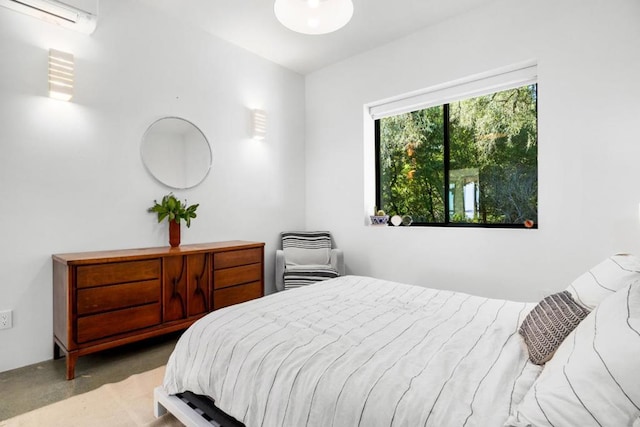 bedroom with a wall unit AC