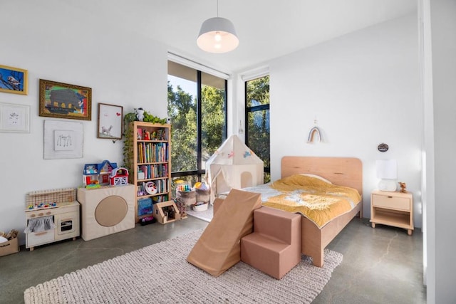 bedroom featuring floor to ceiling windows