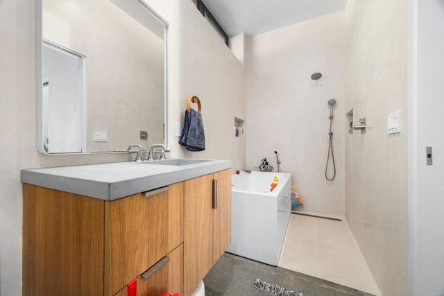 bathroom featuring vanity, concrete floors, and a tub to relax in