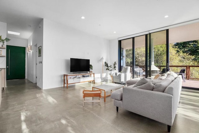 living room featuring a wall of windows