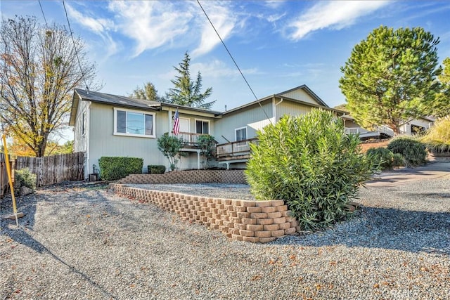 bungalow-style house with a wooden deck