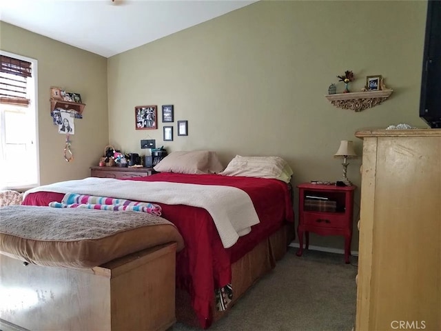 bedroom featuring light colored carpet