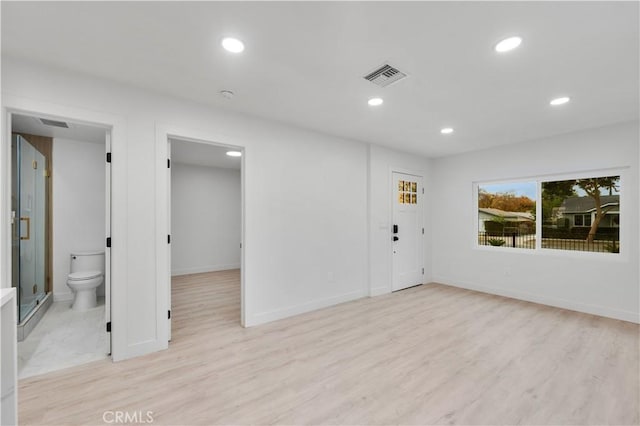 unfurnished room with light hardwood / wood-style flooring