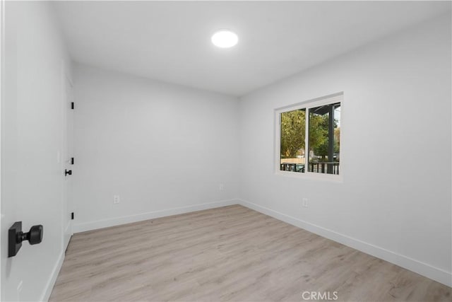 unfurnished room with light hardwood / wood-style floors