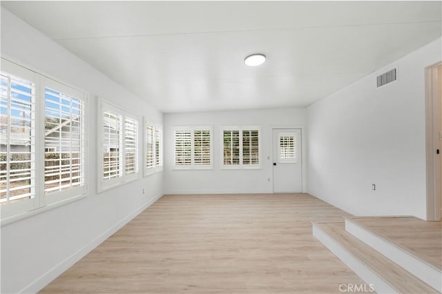 unfurnished sunroom featuring plenty of natural light