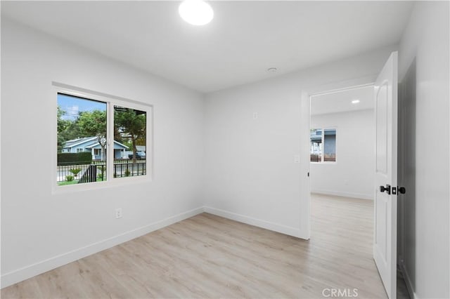 spare room featuring light hardwood / wood-style floors