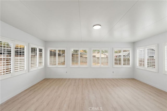 unfurnished sunroom with plenty of natural light