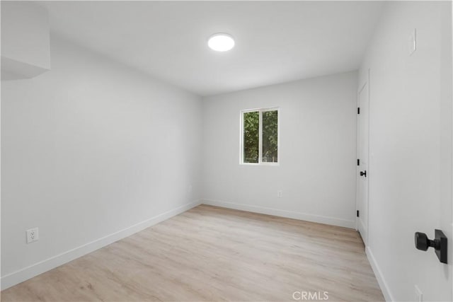 unfurnished room featuring light hardwood / wood-style floors