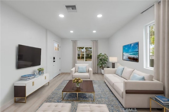 living room with light hardwood / wood-style floors