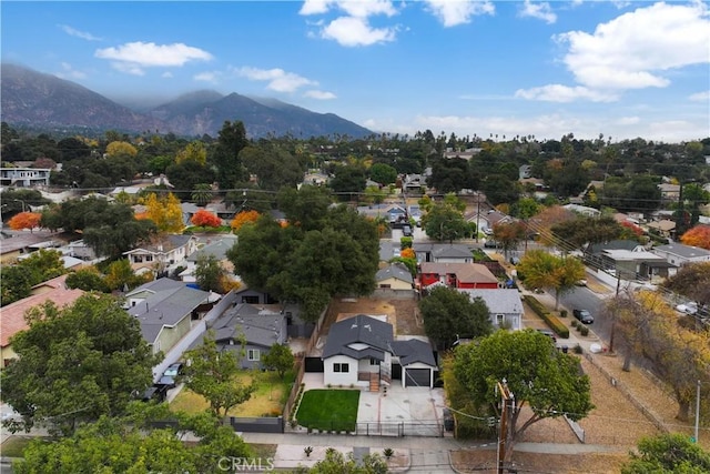 birds eye view of property with a mountain view