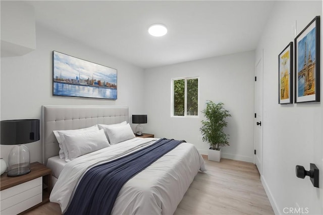 bedroom with light hardwood / wood-style floors