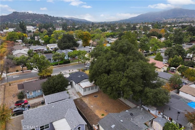 birds eye view of property with a mountain view