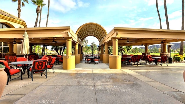 view of patio / terrace featuring a gazebo and ceiling fan