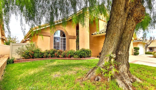 view of side of home featuring a lawn