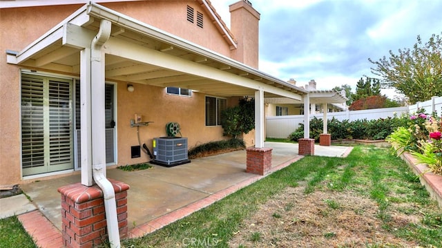 exterior space with a pergola, central AC, and a patio area