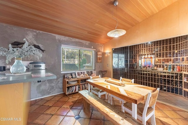 dining room with lofted ceiling and wooden ceiling