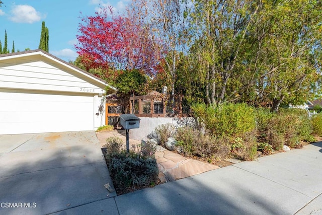 view of property exterior featuring a garage