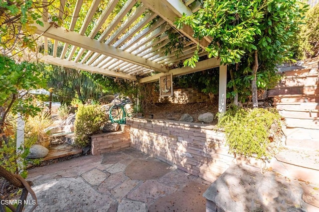 view of patio / terrace featuring a pergola