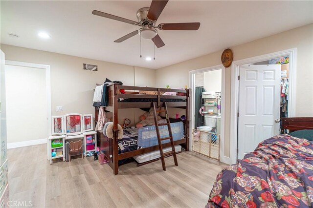 bedroom with light wood-type flooring and ceiling fan