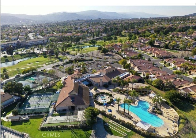 aerial view featuring a water and mountain view