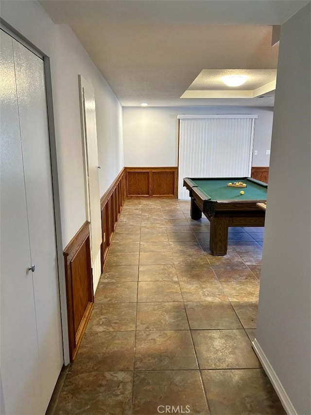 game room featuring a raised ceiling and billiards