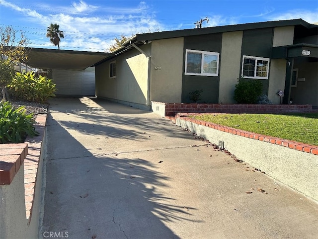 view of front of property with a carport