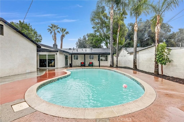 view of pool featuring a patio area