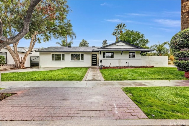 ranch-style house with a front yard