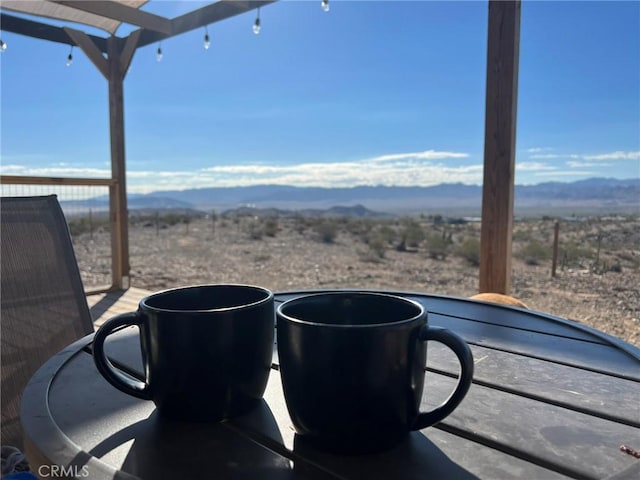 view of patio with a mountain view and a pergola