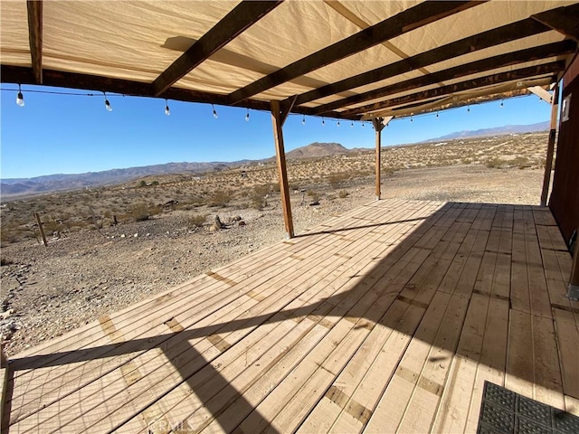 wooden terrace featuring a mountain view