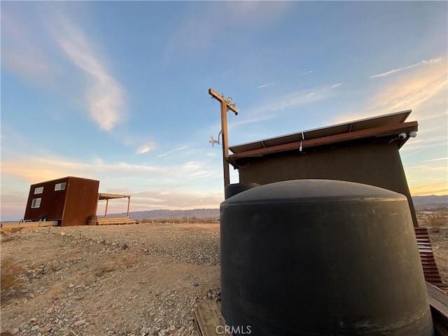 view of outdoor structure at dusk