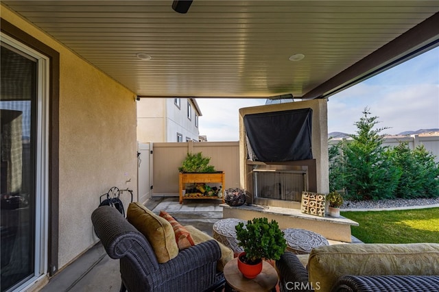 view of patio / terrace featuring exterior fireplace