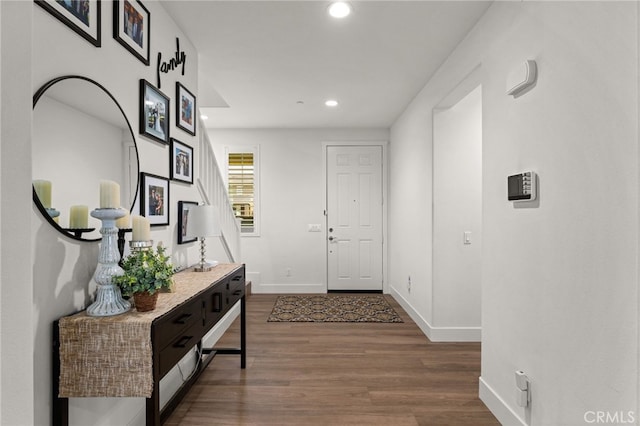 hall with hardwood / wood-style flooring