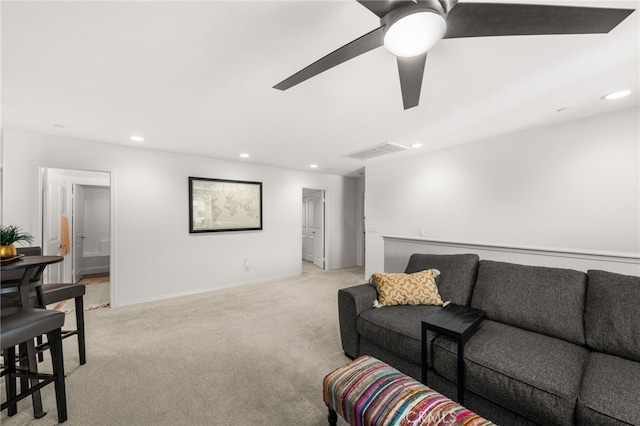 living room featuring ceiling fan and light colored carpet