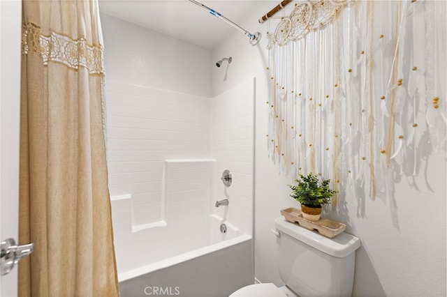 bathroom featuring toilet and shower / tub combo with curtain