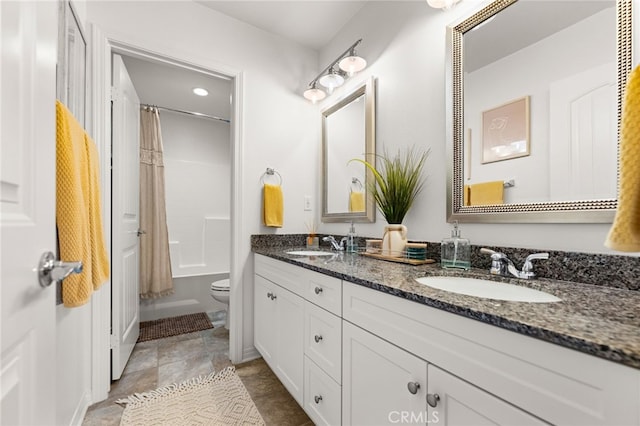 full bathroom featuring vanity, toilet, and shower / tub combo