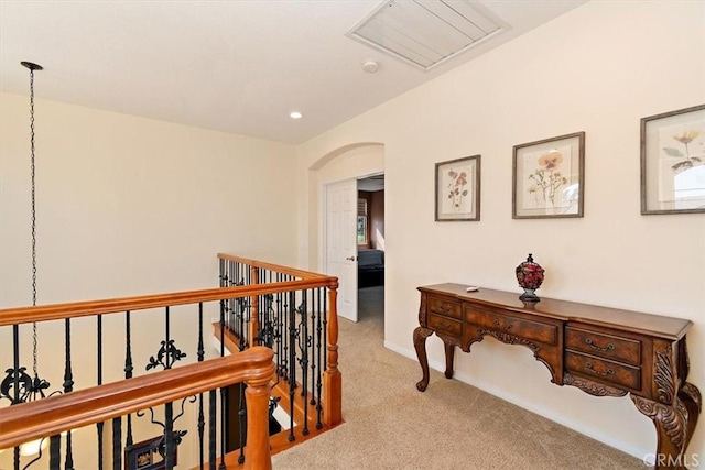 corridor with light colored carpet