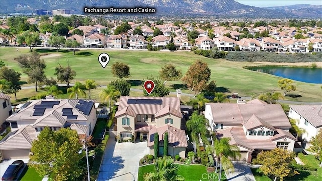 birds eye view of property featuring a water and mountain view