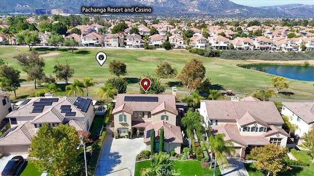 bird's eye view with a residential view, view of golf course, and a water view