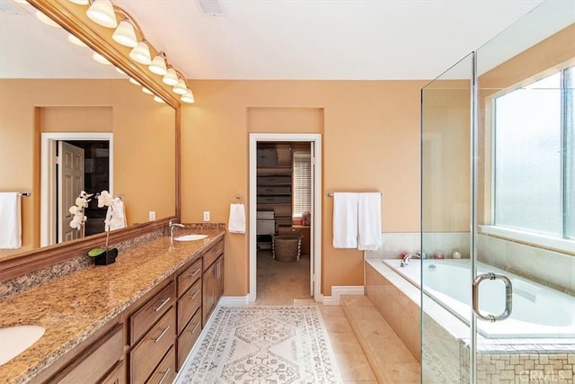 bathroom featuring tile patterned flooring, vanity, and independent shower and bath